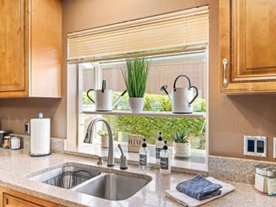 Experience the sleek and modern design of the stainless steel sink in this contemporary kitchen. The stainless-steel material not only adds a touch of elegance but also offers durability and easy maintenance.