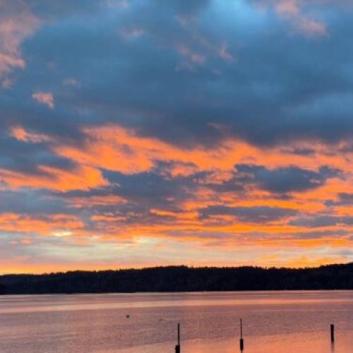 Guest photo of a sunset from Sand Dollar Beach Cottage. 

Photo credit: D. Grant