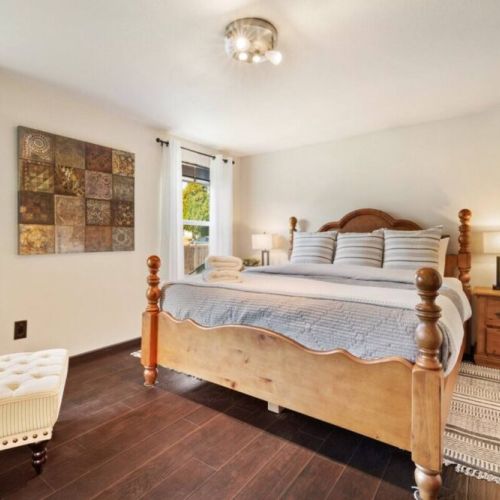 Head upstairs to the spacious King En Suite - luxury bedding, touch lampos with USB outlets, and a sound machine help lull you to sleep.