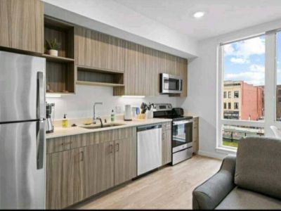 View of the full kitchen from the living room. Fully stocked and ready for you to prep your favorite home-cooked meal.