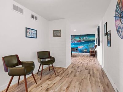 The lower level of the home offeres ample space to gather for chats, playing games, and watching TV.