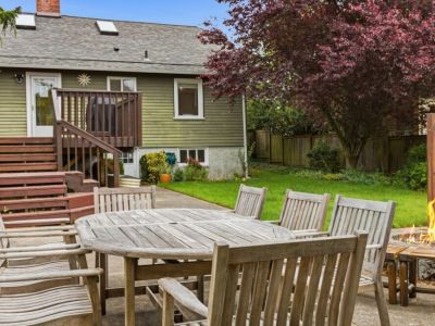 Dine al fresco while gathered around the aged teak outdoor dining-seats 8