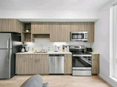 From the rhythmic hum of appliances to the gleam of stainless steel, this kitchen is the essence of a space where meals are crafted with love and shared with joy