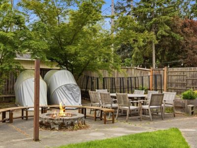 The outdoor fire pit has 4 moveable curved benches to enjoy the warmth
