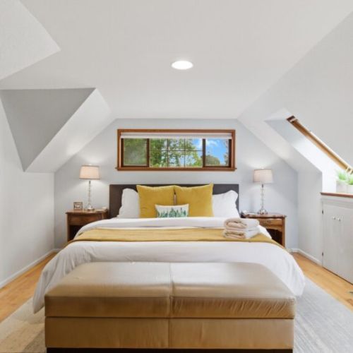 Our King bedroom boasts comfy bedding and plenty of room to relax.