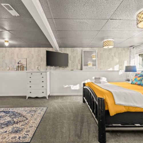 Chill in the spacious lower level King bedroom suite with its own sitting area, office desk, mini fridge, a 50" Smart TV, and a gas fireplace...nestle in.