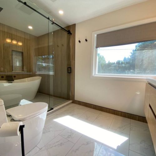 En Suite Bathroom-the ultimate luxury! Double vanities. Wet Room with a Freestanding Soaking Tub, Rain Head Shower System, and marble floors.
