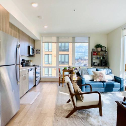 Full view of the open living space: kitchen, dining, and living room.