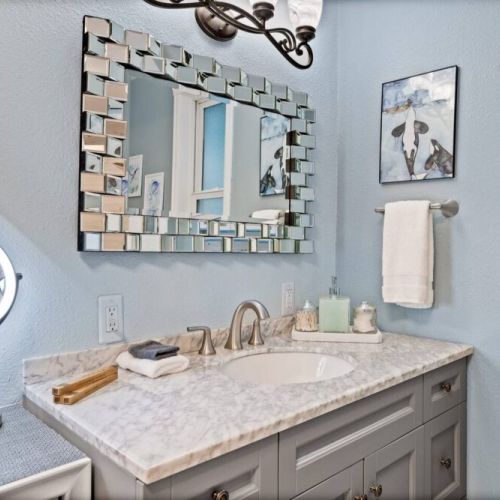 Step into this well-lit full bathroom on the main floor, where every detail has been carefully considered to provide a complete and luxurious bathing experience.