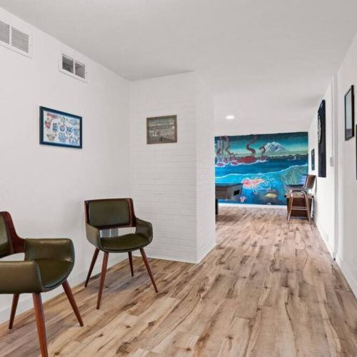 The lower level of the home offeres ample space to gather for chats, playing games, and watching TV.