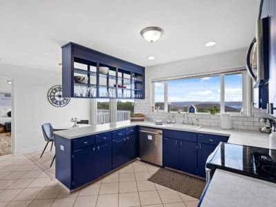 A fully stocked kitchen with culinary possibilities, showcasing an array of cookware, utensils, and ingredients. Home cooked meals are just the best!