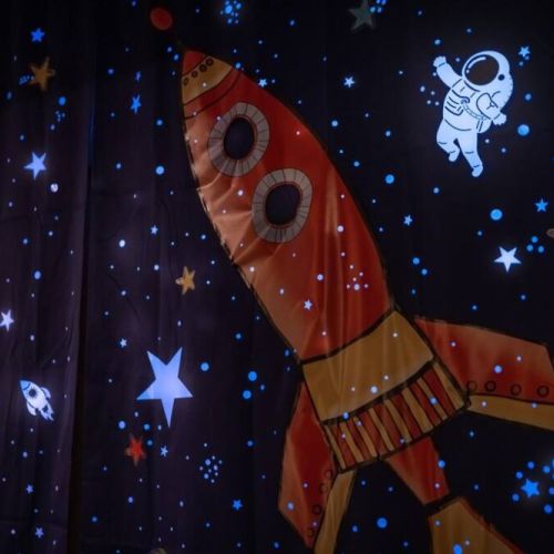 An intergalactic adventure as the lights go out in this captivating space-themed kids' room. Let them explore the galaxy in this dreamy space.