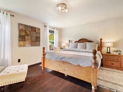 Head upstairs to the spacious King En Suite - luxury bedding, touch lampos with USB outlets, and a sound machine help lull you to sleep.