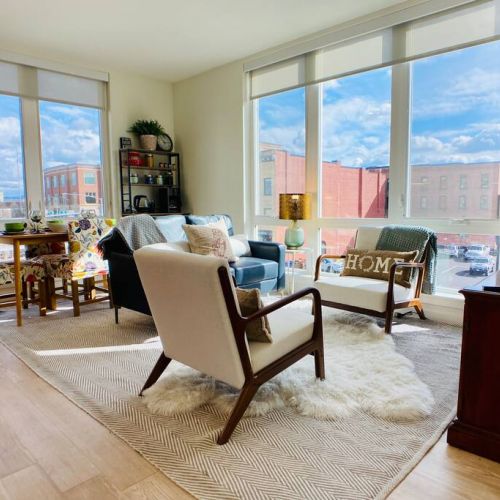 Cozy open concept living space with living, dining, and kitchen.