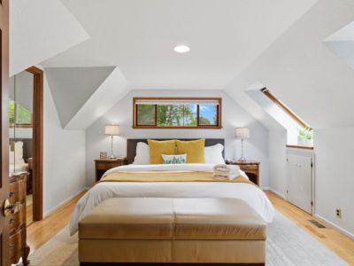 Our King bedroom boasts comfy bedding and plenty of room to relax.