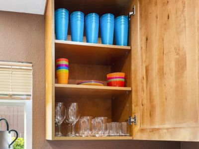 The abundance of cups and glasses in this well-stocked kitchen adds a touch of convenience and sophistication to your dining experience.