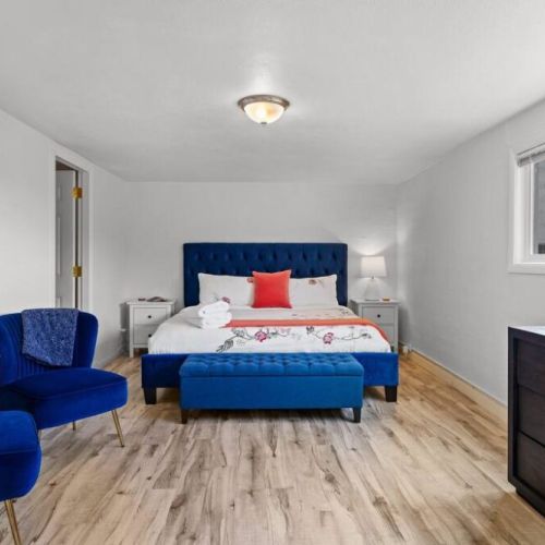 King bedroom with sitting area is tucked away in the lower level just off of the game room.