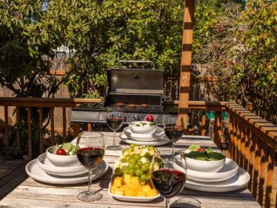 Dine al fresco! There is plenty of room for everyone to sit at the table on the deck or the shady patio table in the yard.