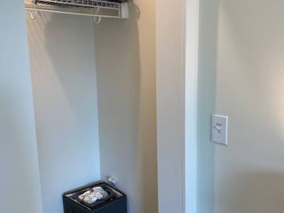 A Graco Pack & Play, Graco fitted sheet, and a child’s booster/high chair is conveniently stored for guest use, if needed.