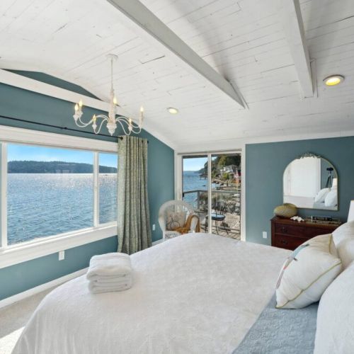 The décor is a symphony of soothing blues and neutral tones, with coastal-inspired accents that mirror the beauty of the sea.