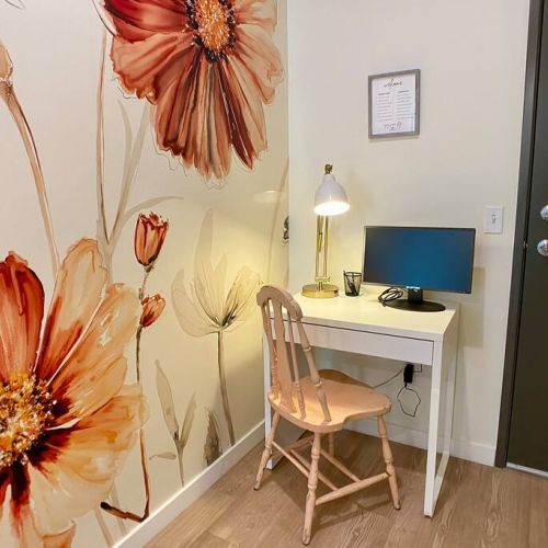 The workstation is located in a quiet nook of the entry hallway.