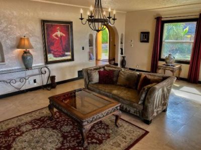 Radient heated travertine floors throughout this large living room makes family and friends movie night cozy and warm.