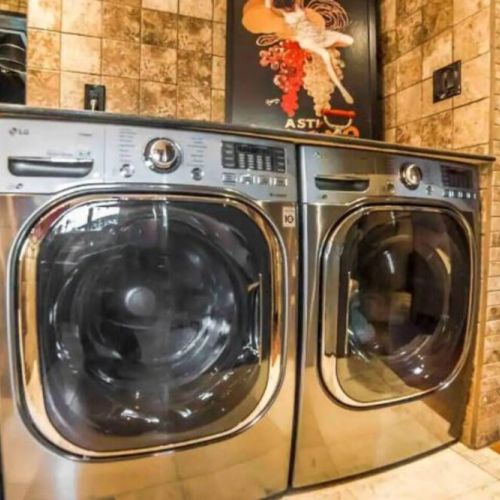 Full-size washer & dryer are conveniently located on the main floor in the Prep Kitchen area.