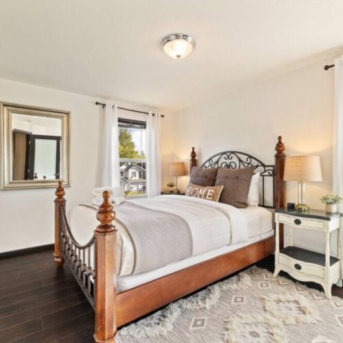 Experience serene comfort in this Queen bedroom adorned with soft creams and greys, creating a soothing and inviting ambiance. Unwind as you enjoy your favorite shows on the 42" Smart TV, and conveniently charge your devices with the USB lamps.