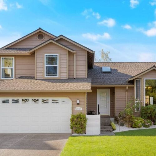 Welcome to Urban Retreat! A dream home, showcasing a stunning front view that exudes charm and appeal. The inviting entryway, adorned with lush landscaping and a welcoming porch, sets the stage for a warm and inviting atmosphere that awaits inside.