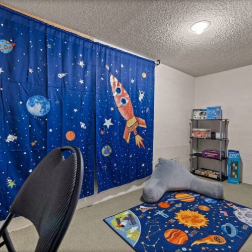 Ignite your child's imagination in this spaciously designed playroom, where kids can explore and play to their hearts' content. With a plethora of games and activities at their fingertips for endless entertainment and fun